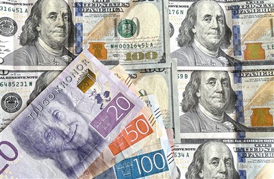 图为瑞典克朗和美元纸币。